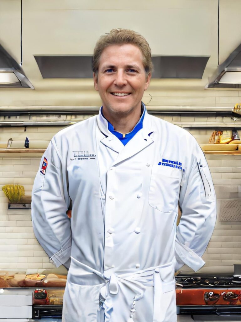 Desmond Clarke in his kitchen, showcasing his culinary journey