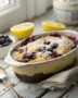 A warm, bubbly lemon-blueberry cobbler, showcasing one of the most comforting recipes with lemon cake mix.