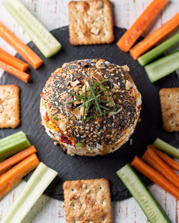 A creamy, golden cheese ball rolled in a crunchy coating of toasted walnuts and everything bagel seasoning, ready to amplify snack brands on your appetizer table.