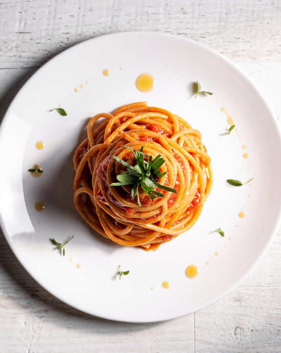 A golden, bubbly pan of baked spaghetti fresh from the oven.