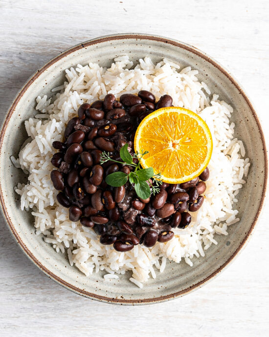 A steaming bowl of rich black beans brazilian, ready to be enjoyed.