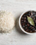 A rustic bowl of creamy black beans served alongside fluffy white rice, showcasing the classic comfort of brazil beans and rice.