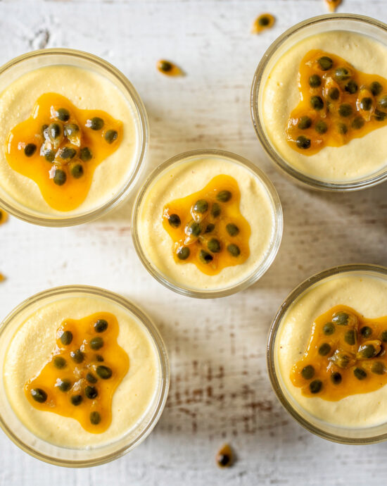 A light and creamy Brazilian passion fruit mousse served in a glass, topped with fresh pulp and seeds.