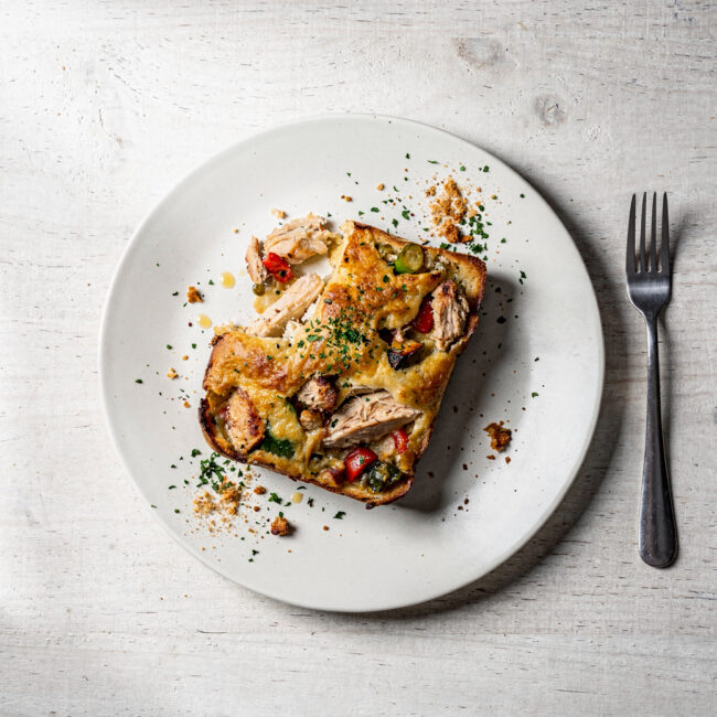 A golden brown chicken casserole with a crispy herb topping, ready to serve.