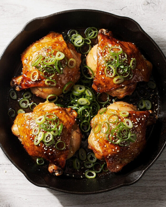 A pan full of perfectly glazed and roasted chicken thigh recipes ready to serve.