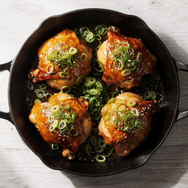 A pan full of perfectly glazed and roasted chicken thigh recipes ready to serve.
