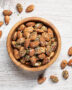 A rustic bowl filled with savory herb almond mix, showcasing the best of healthy snacks at walgreens for a quick and delicious bite.