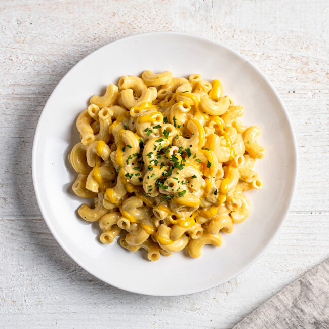 A creamy, golden baked mac and cheese showcasing the perfect use of mustard in mac and cheese for enhanced flavor.
