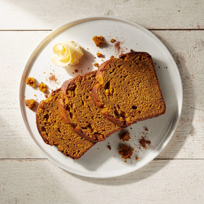 A perfect slice from the pumpkin bread recipe pioneer woman, showcasing its moist crumb and crackly sugar top.