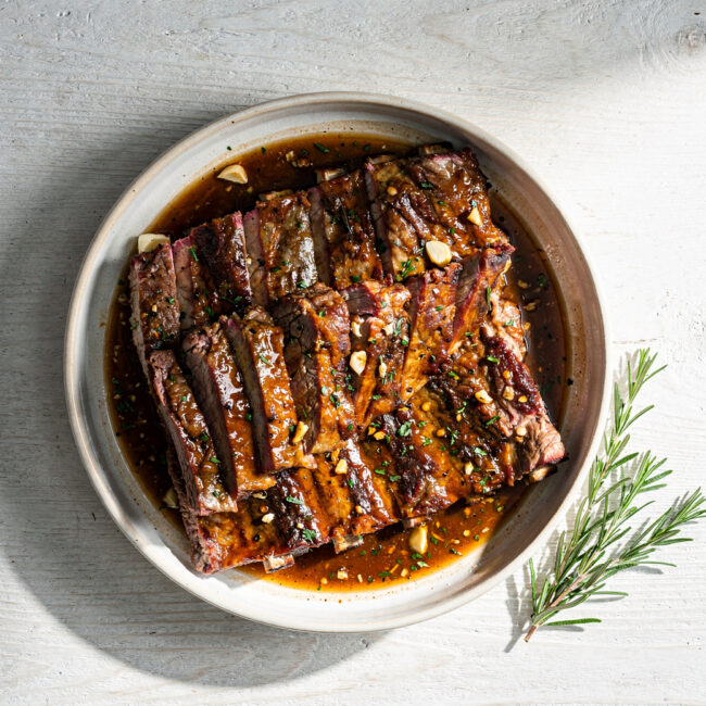 The perfect slab of pork ribs, coated in a glossy, deeply caramelized rib marinade overnight.