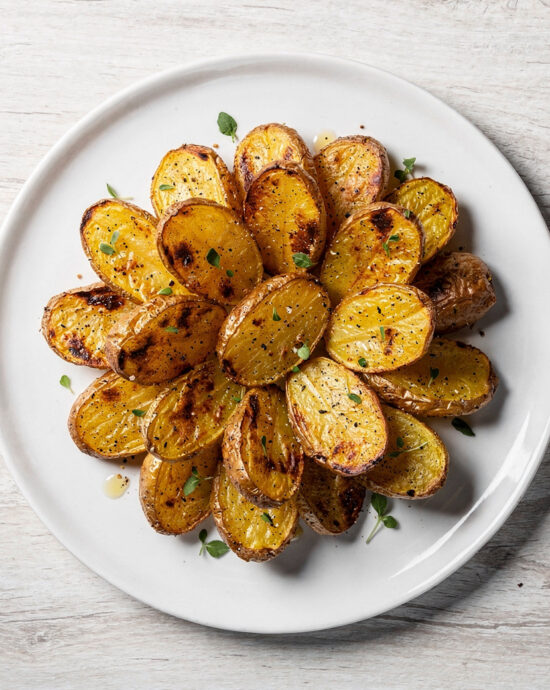 A golden-brown batch of crispy roasted potatoes with onion soup mix, perfectly seasoned and ready to serve.