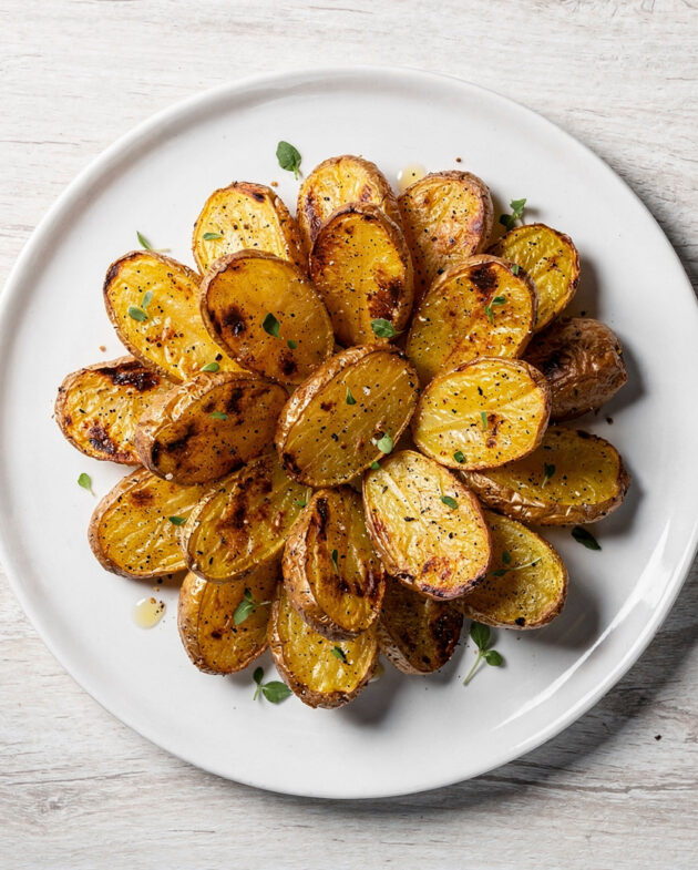 A golden-brown batch of crispy roasted potatoes with onion soup mix, perfectly seasoned and ready to serve.