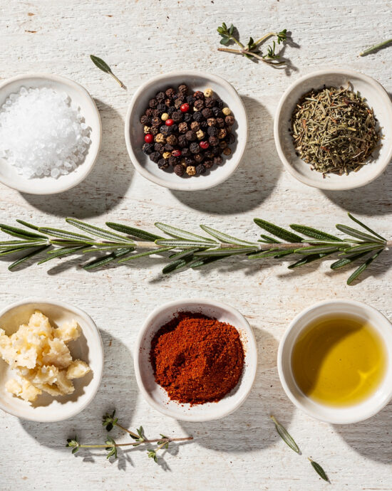 A close-up shot of a perfectly cooked pork tenderloin with a dark, flavorful crust from a simple seasoning for pork tenderloin, sliced to reveal juicy, pink interior.