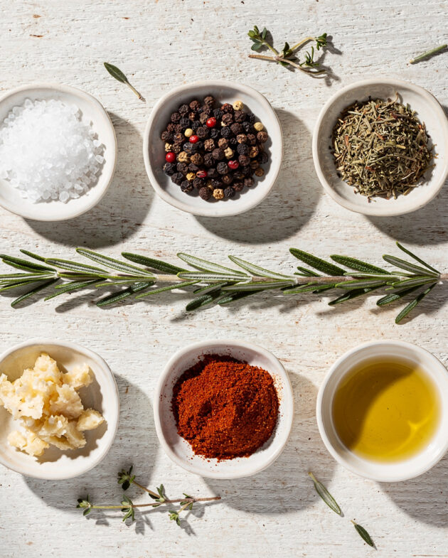 A close-up shot of a perfectly cooked pork tenderloin with a dark, flavorful crust from a simple seasoning for pork tenderloin, sliced to reveal juicy, pink interior.