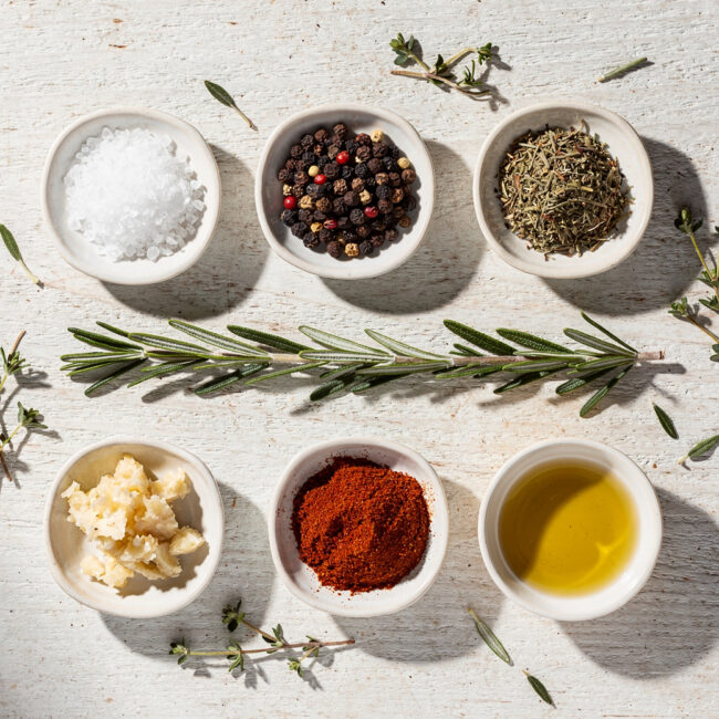 A close-up shot of a perfectly cooked pork tenderloin with a dark, flavorful crust from a simple seasoning for pork tenderloin, sliced to reveal juicy, pink interior.