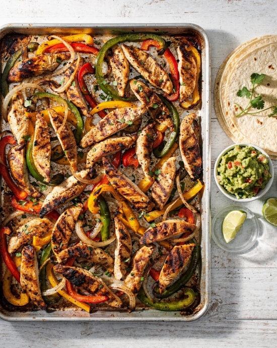 A vibrant sheet pan chicken fajita recipe with sizzling chicken and colorful peppers ready to serve.