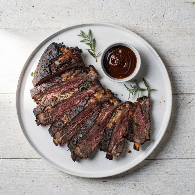 The finished, glistening rack from our traeger beef ribs recipe, ready to be pulled apart.
