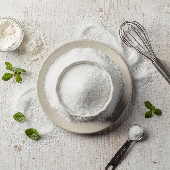 A slice of moist buttermilk coffee cake made with a white sugar alternative for baking, showing a perfect crumb and cinnamon streusel topping.